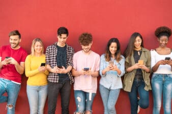 young people stare at smartphones